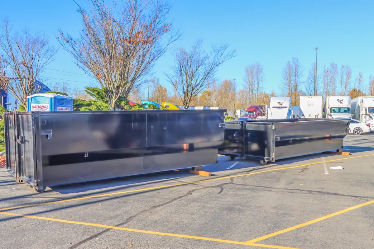 Professional dumpster rental service with roll-off container on residential driveway in Rancho Mirage